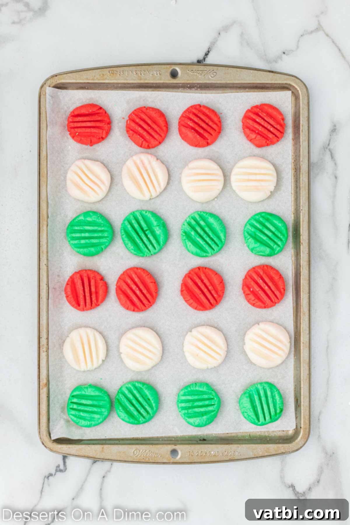 Holiday Mint Magic 8 Mints arranged on a baking sheet, waiting to set and harden.