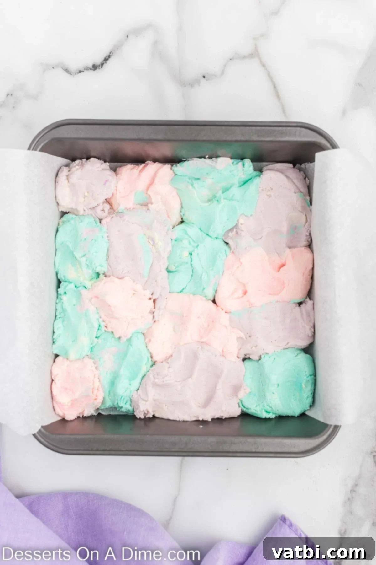 Rainbow Unicorn Fudge 7 Fudge dolloped into pan alternating colors.
