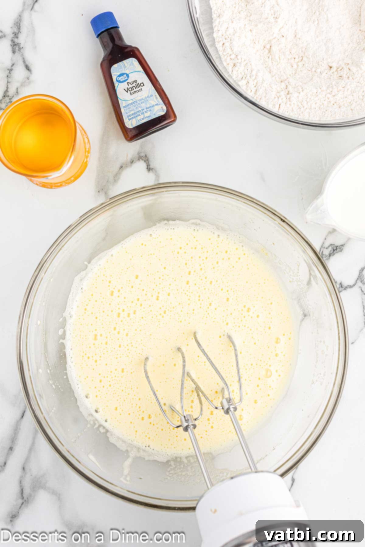Eggs and sugar added to bowl. 