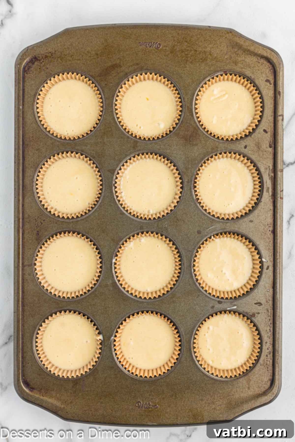 Batter in muffin tins. 