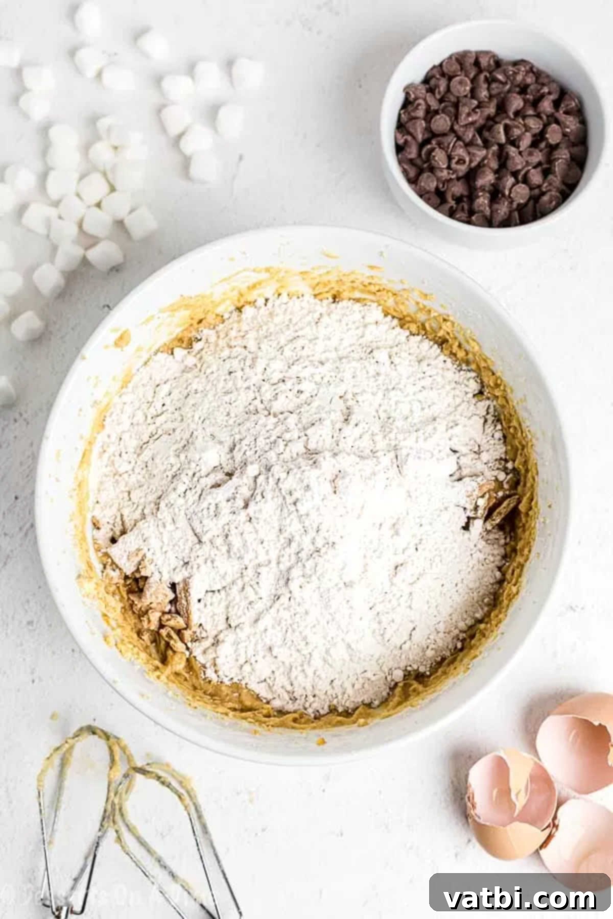 Campfire S'mores Cookies 2 Bowl with flour, crushed graham crackers and baking powder combined.