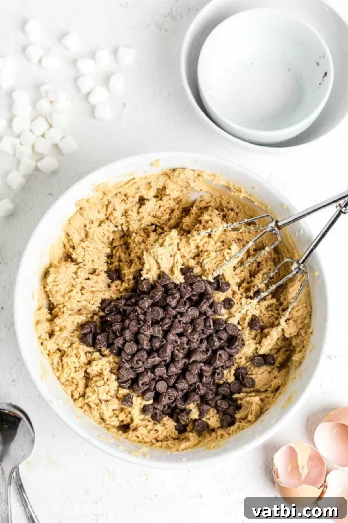 Campfire S'mores Cookies 3 Bowl with wet and dry ingredients combined to form cookie dough.