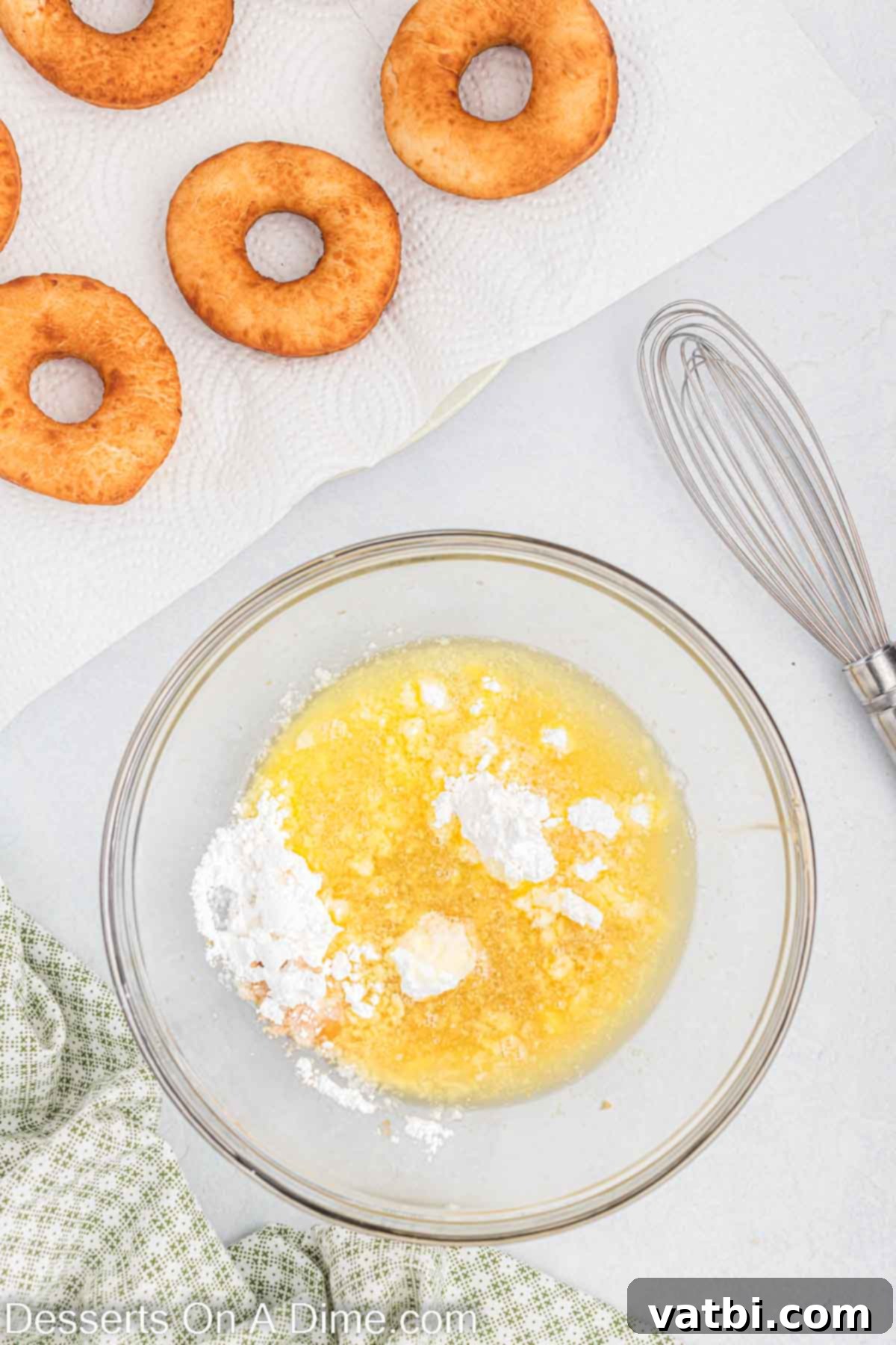 Homemade Krispy Kreme Doughnuts: The Ultimate Guide 13 Mixing bowl with glaze ingredients combined, ready for whisking.