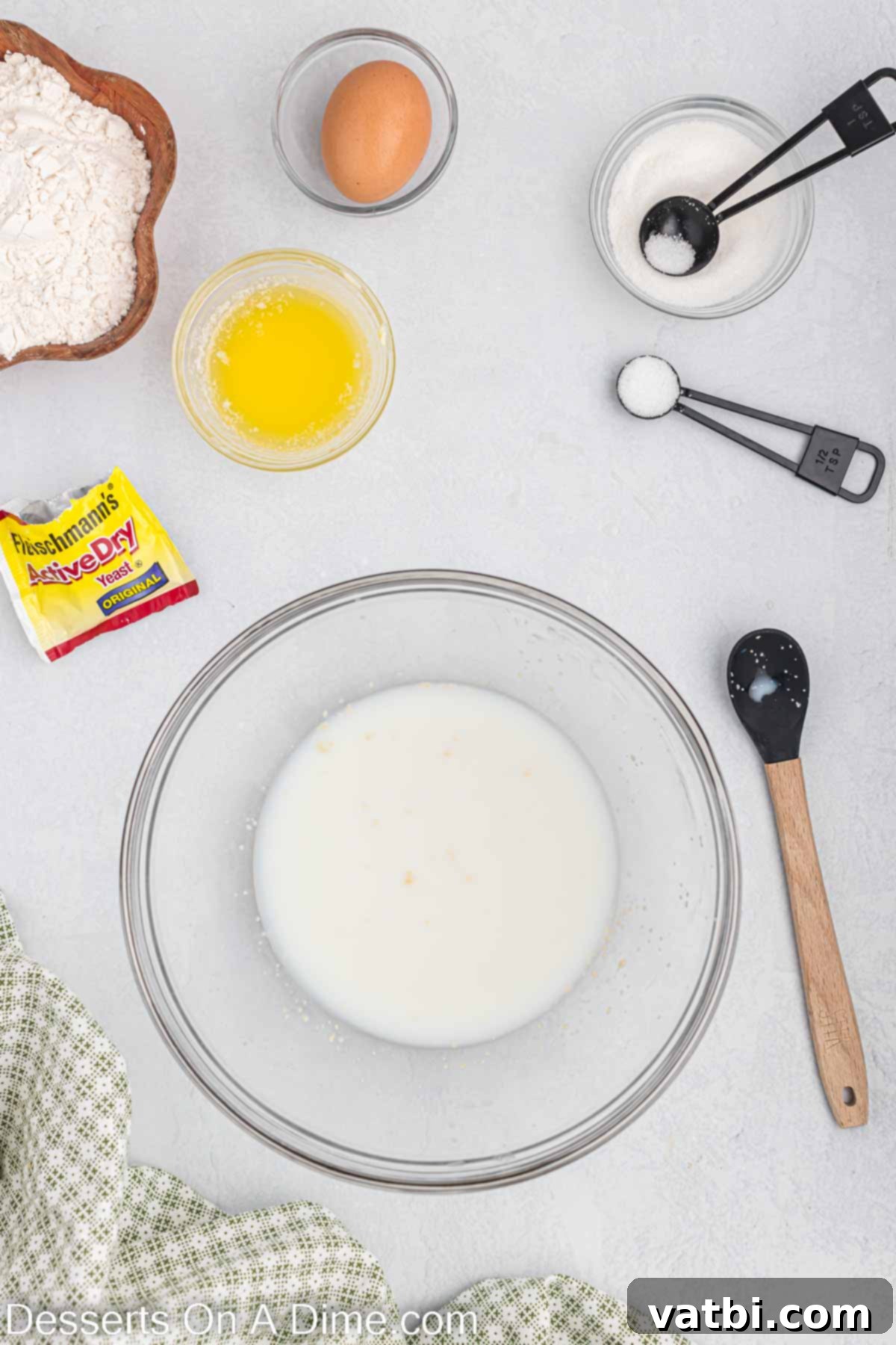 Homemade Krispy Kreme Doughnuts: The Ultimate Guide 4 Milk and water in a bowl ready for yeast activation.