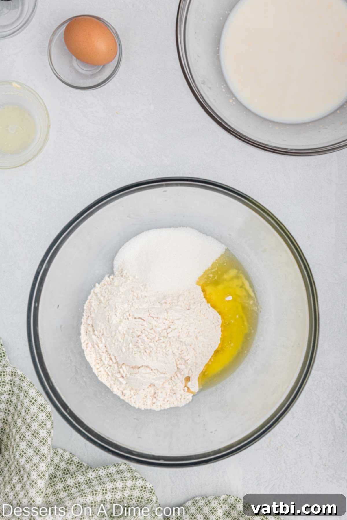 Homemade Krispy Kreme Doughnuts: The Ultimate Guide 5 Separate bowl with melted butter, flour, sugar and salt for donut dough.