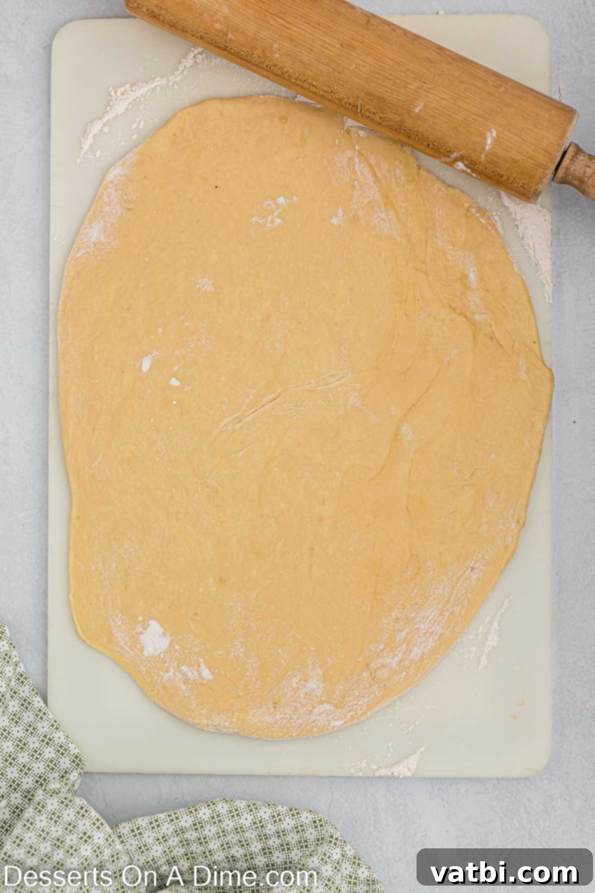 Homemade Krispy Kreme Doughnuts: The Ultimate Guide 10 Donut dough rolled out on the counter, ready for cutting.