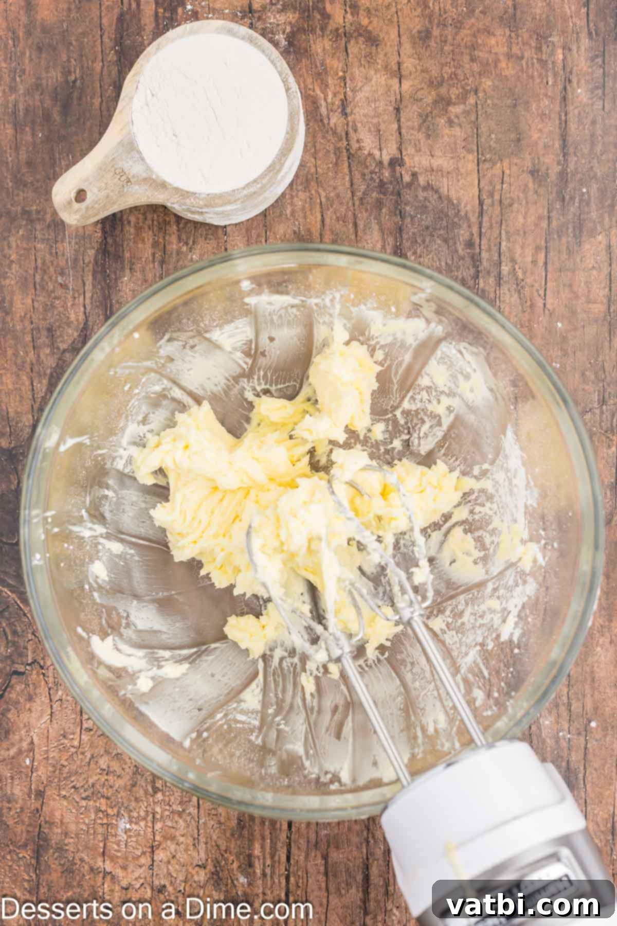 Grandma's Irresistible Lemon Squares 2 Butter and powdered sugar creamed together in a bowl.