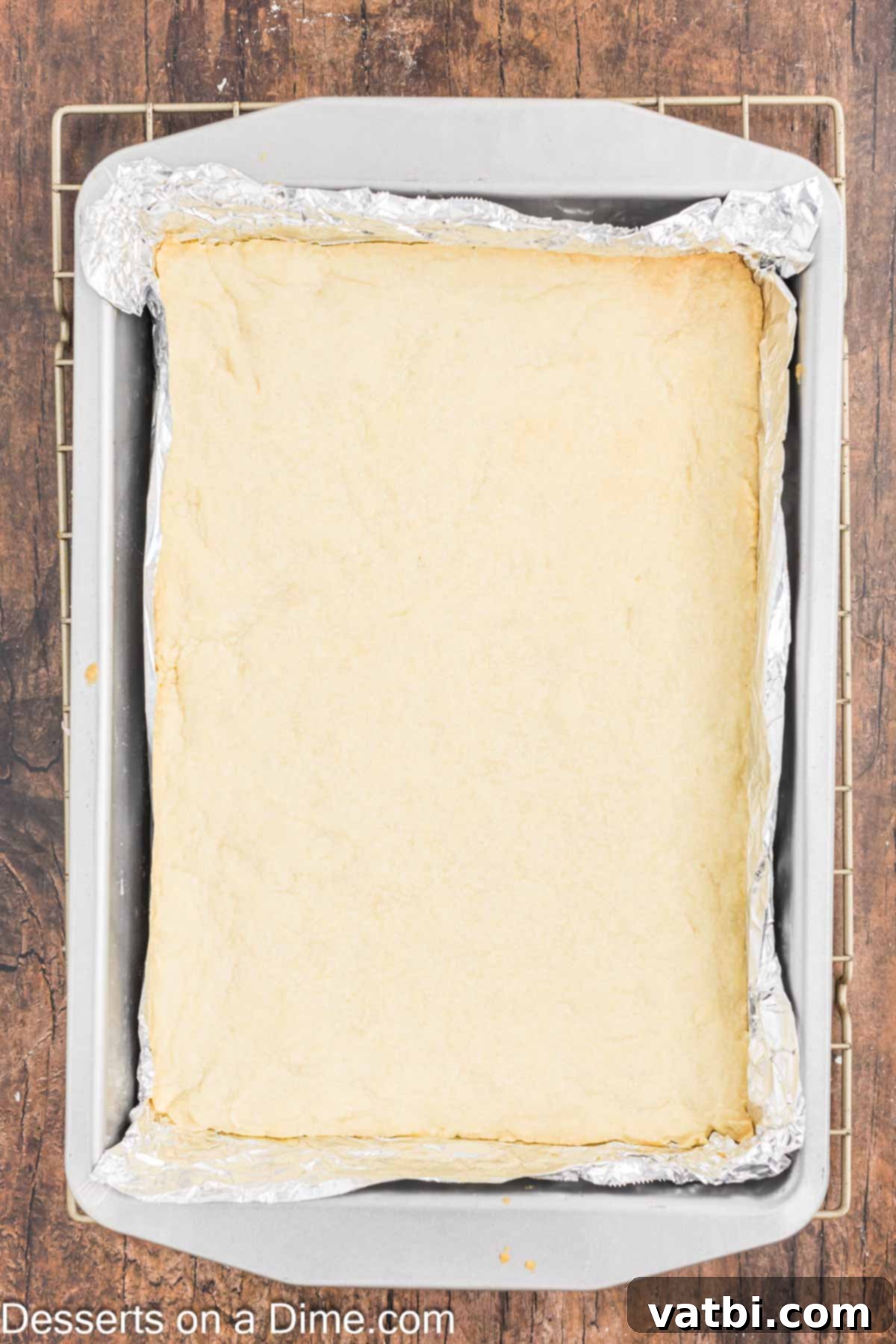 Grandma's Irresistible Lemon Squares 3 Crust pressed into pan to make lemon bars.