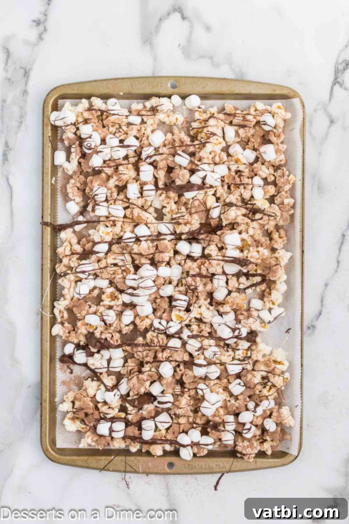 Velvet Chocolate Popcorn 9 Chocolate Melted and drizzled on top of popcorn.