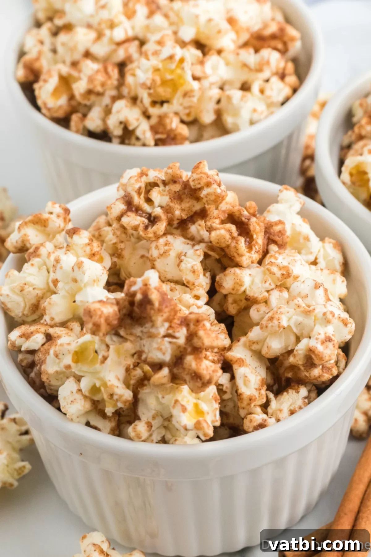 Irresistible Cinnamon Sugar Popcorn 2 Two bowls overflowing with fluffy cinnamon sugar popcorn, ready to be enjoyed.