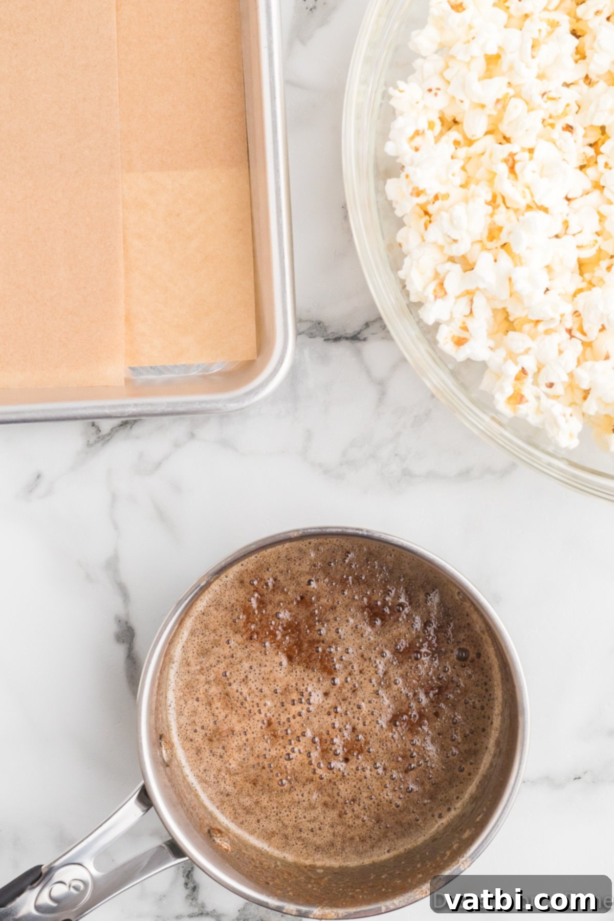 Irresistible Cinnamon Sugar Popcorn 6 The cinnamon sugar butter mixture gently boiling and thickening in the saucepan.