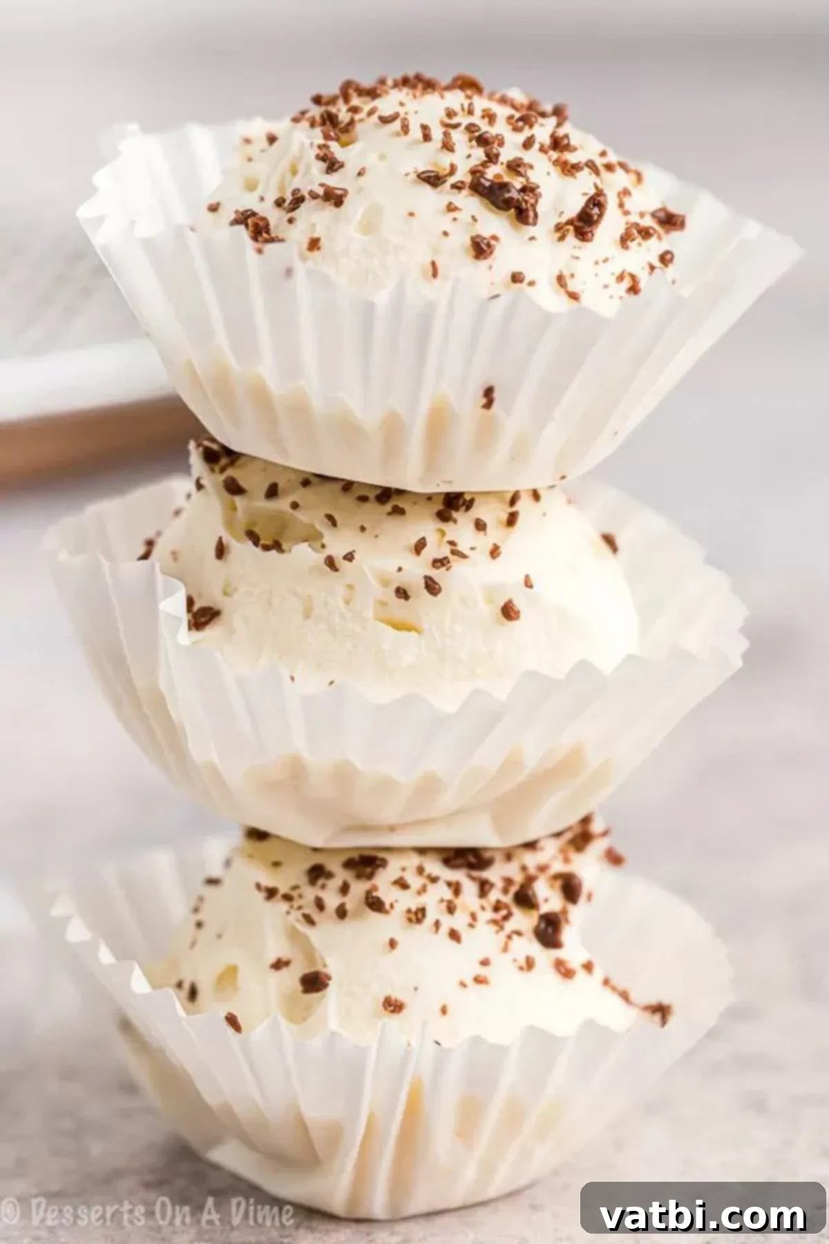 Keto cheesecake fat bomb recipe is a game changer. You can enjoy decadent cheesecake that is keto friendly without any guilt. A stack of creamy Keto Cheesecake Fat Bombs in individual cupcake holders, a perfect low-carb dessert.