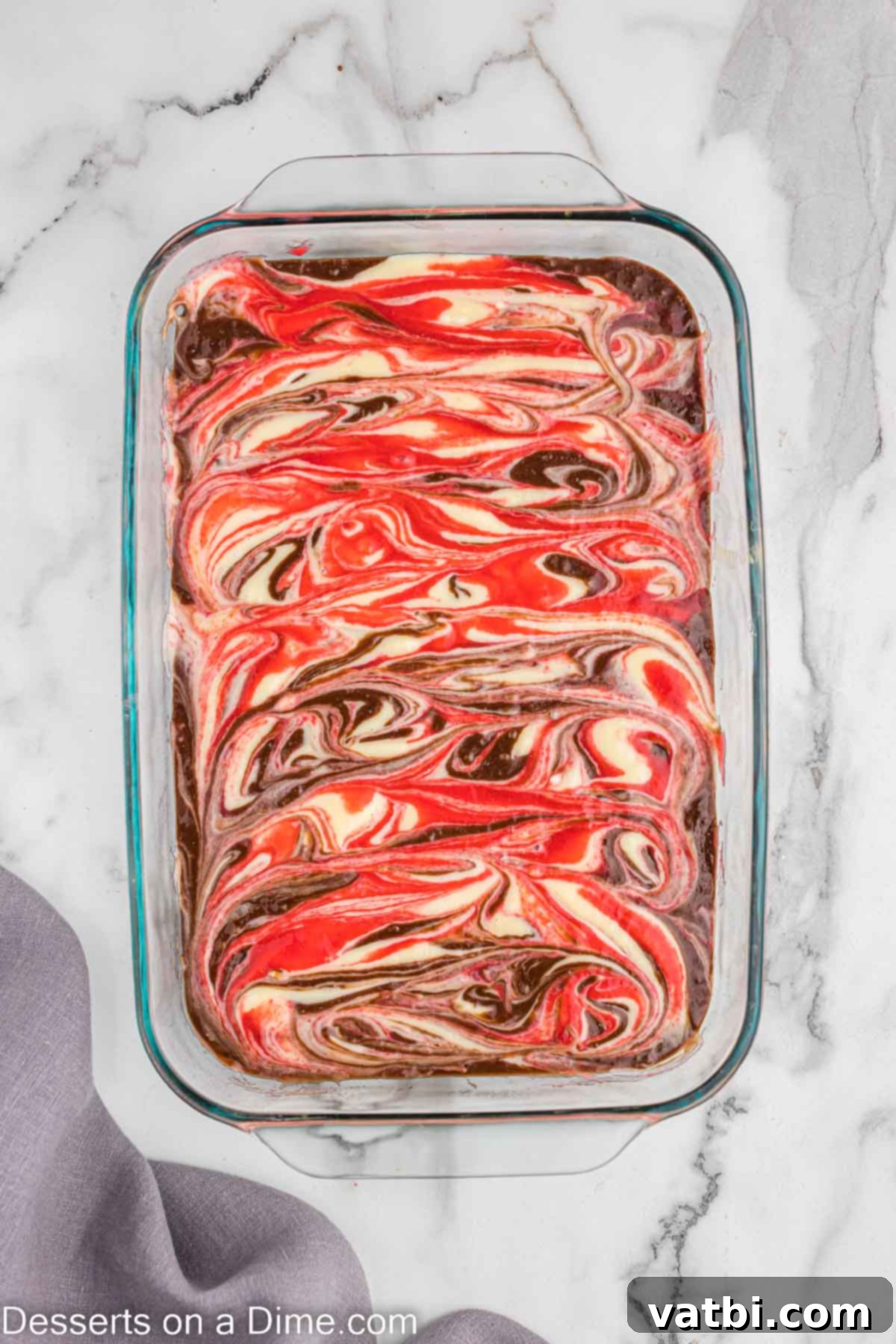 Ruby Swirl Raspberry Cheesecake Brownies 8 Artfully swirling the cheesecake and raspberry layers into the brownie batter with a knife