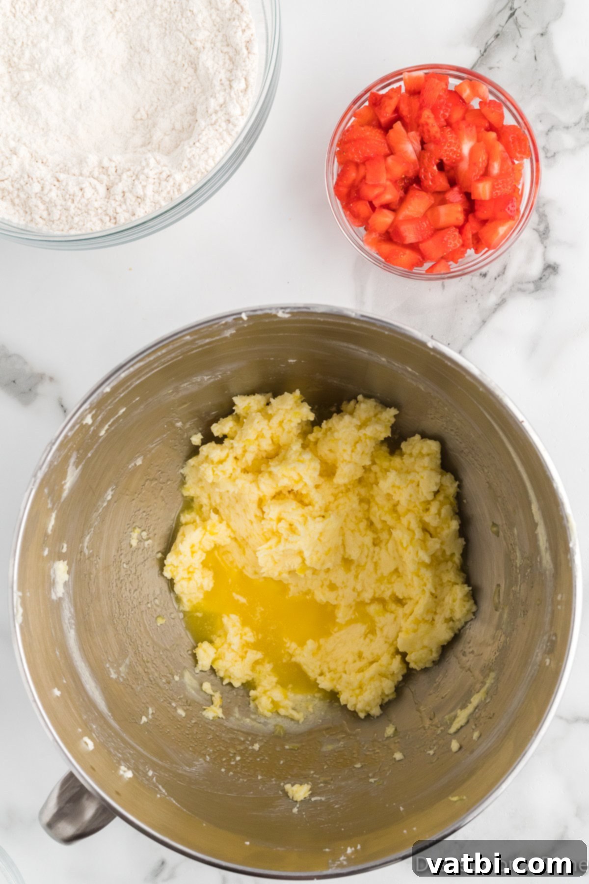 Zesty Strawberry Lemon Blondie Delight 7 Dry ingredients being gently folded into the wet ingredients for the blondie batter.