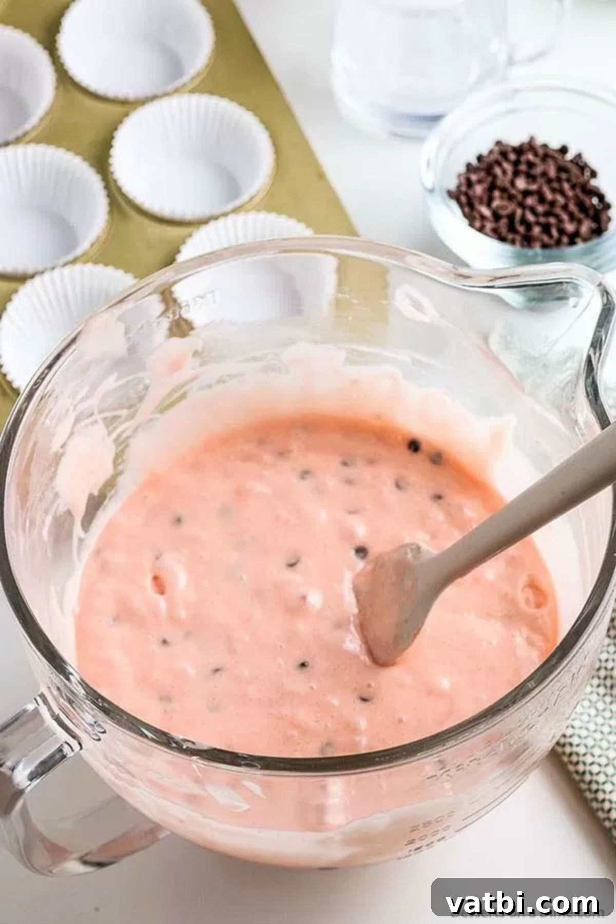 Melon Magic Cupcakes 4 Smooth, pink watermelon cupcake batter in a bowl.