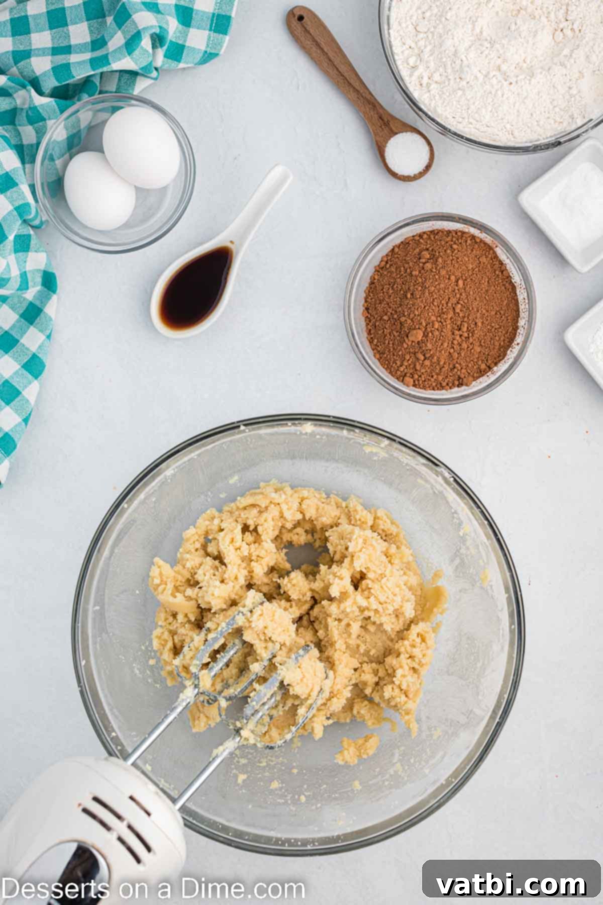 Decadent Triple Chocolate Cookies 4 Butter and sugar combined in a bowl, showing a creamy texture.