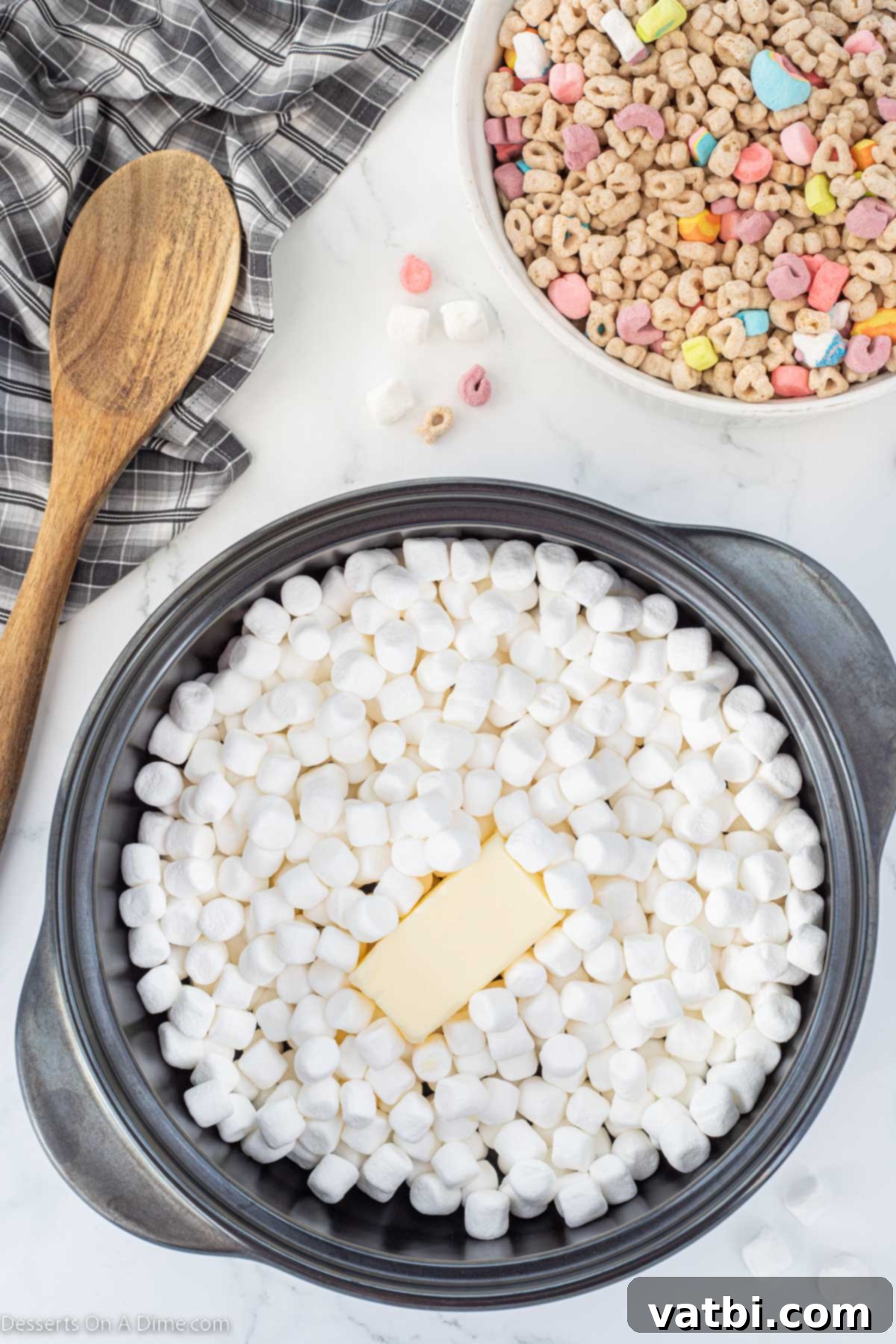 Lucky Charms Treats 4 Marshmallows and butter combined in a pot.