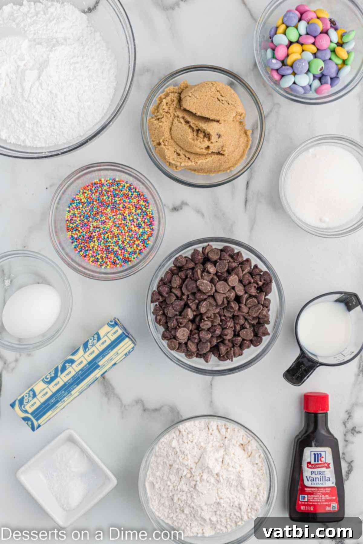 Hoppy Easter Cookie Bake 3 Ingredients needed - butter, brown sugar, sugar, egg, vanilla, flour, baking soda, salt, chocolate chips, M&M's, sprinkles, powdered sugar, milk