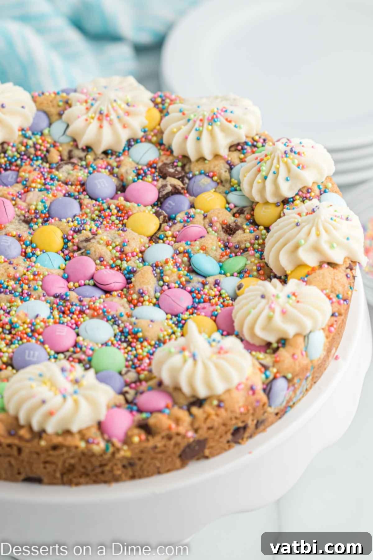 Hoppy Easter Cookie Bake 10 Easter Cookie Cake decorated with pastel colors on a cake stand