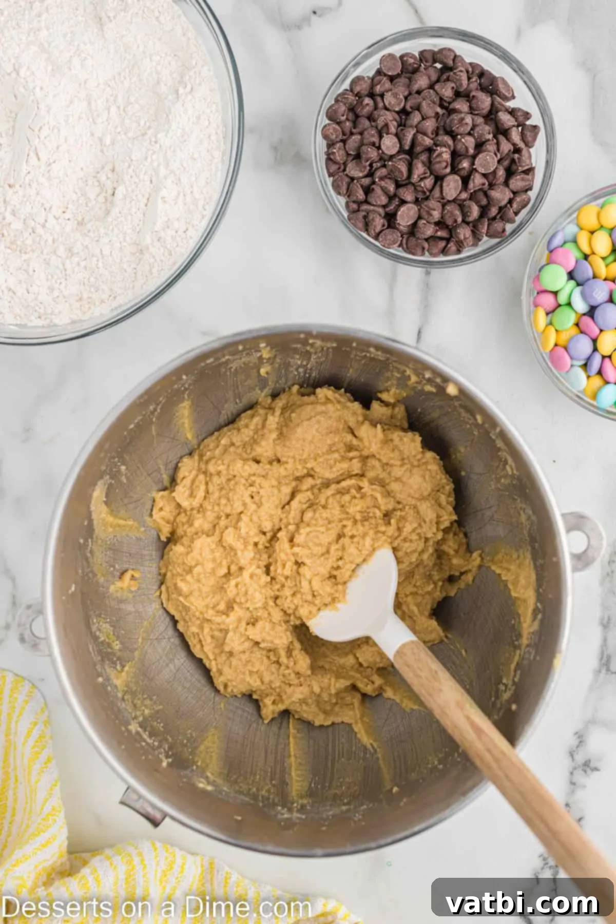 Mixing bowl with eggs and vanilla extract added to the creamed butter and sugar mixture.
