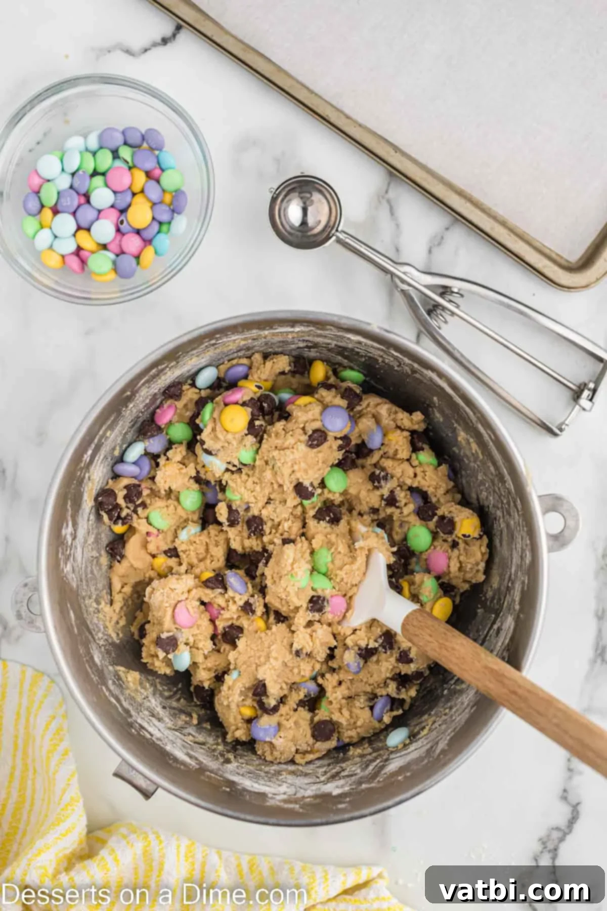 Chocolate chips and M&M's mixed into the cookie dough.