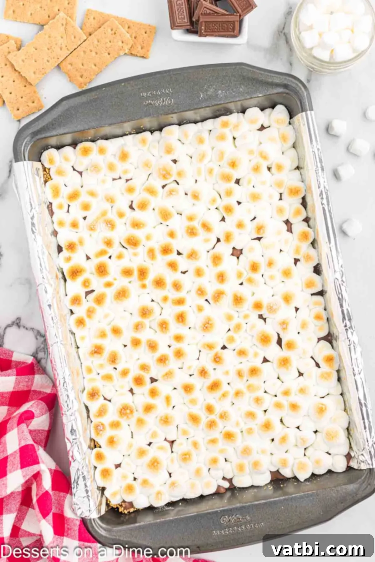Gooey Smores Treat 9 Finished S'mores Bars cooling in the pan before being cut and served.