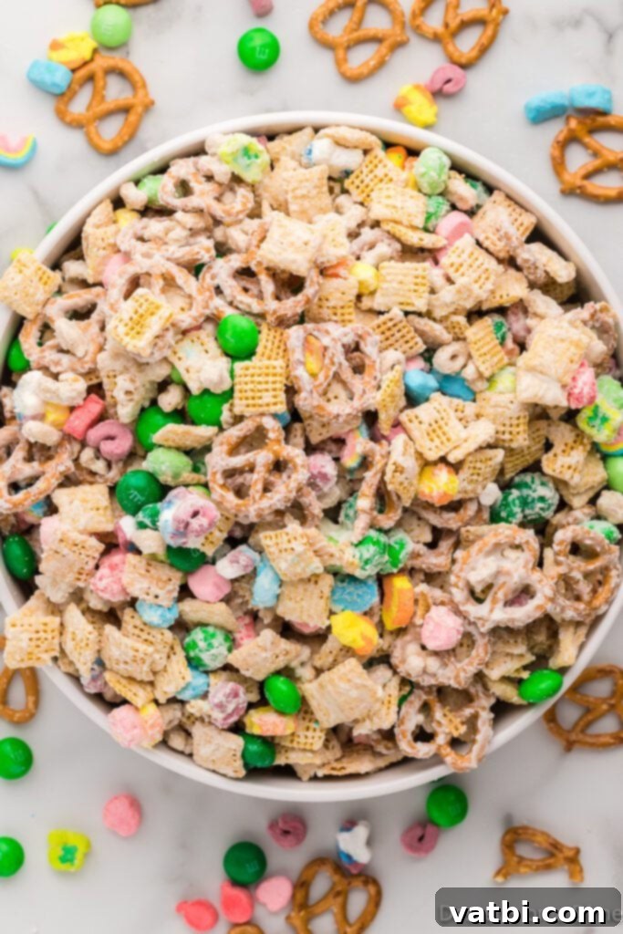 Emerald Enticement 2 A bowl of vibrant green and rainbow-colored Leprechaun Bait snack mix, ready to be enjoyed for St. Patrick's Day.