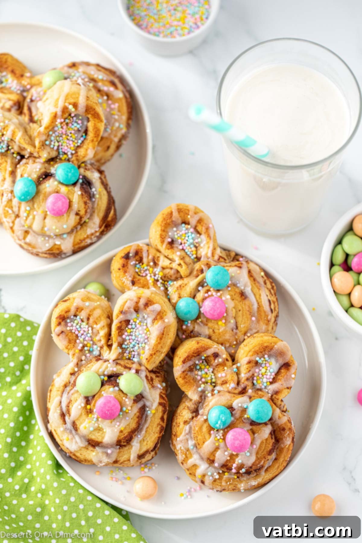 Hoppy Swirls 8 A beautifully arranged platter of freshly baked and decorated Easter Bunny Cinnamon Rolls, showcasing their adorable faces and festive sprinkles, ready to be served as a delightful holiday breakfast or dessert.
