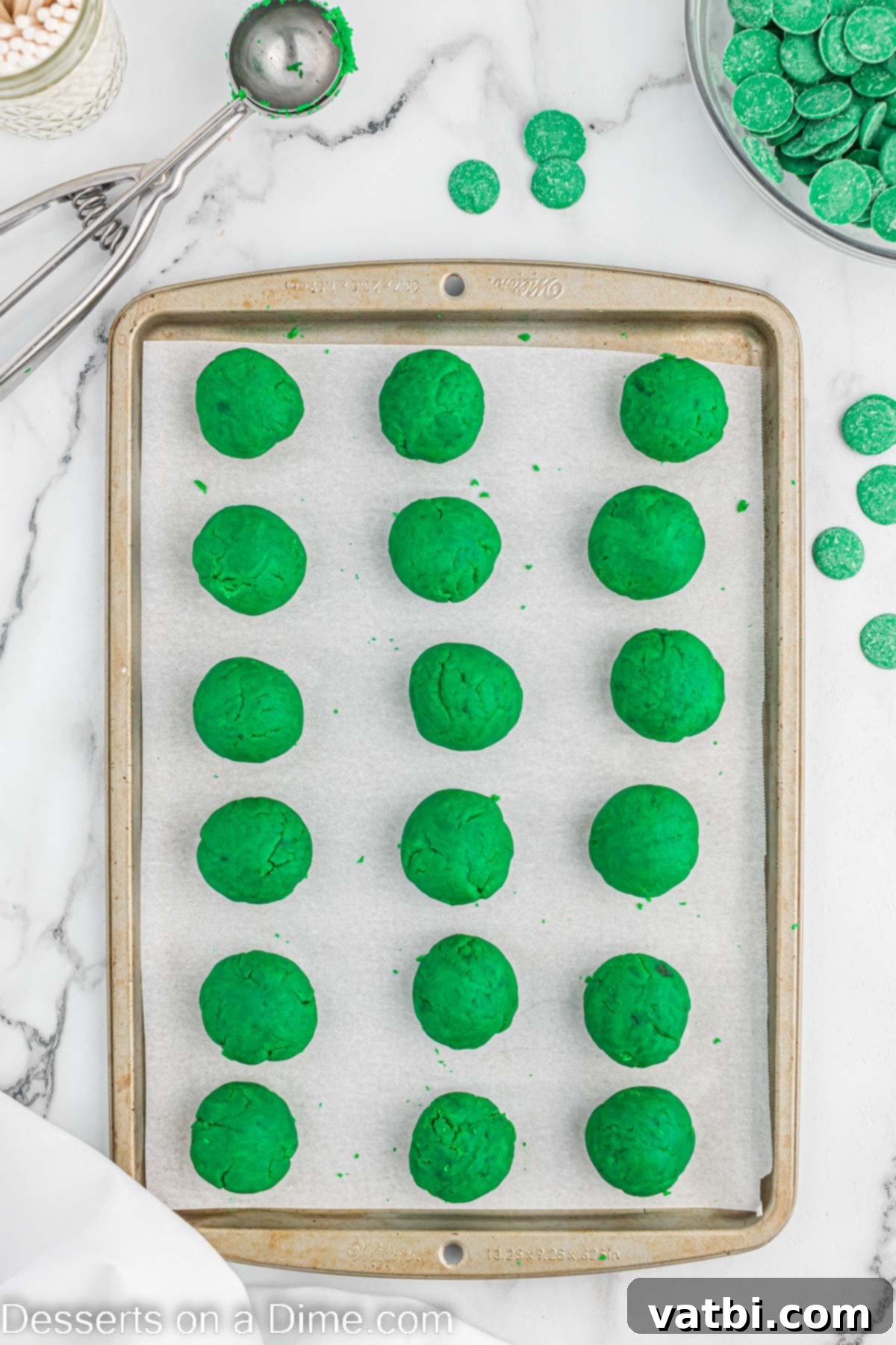 St. Patrick's Day Cake Pops 5 Cake balls on baking sheet.
