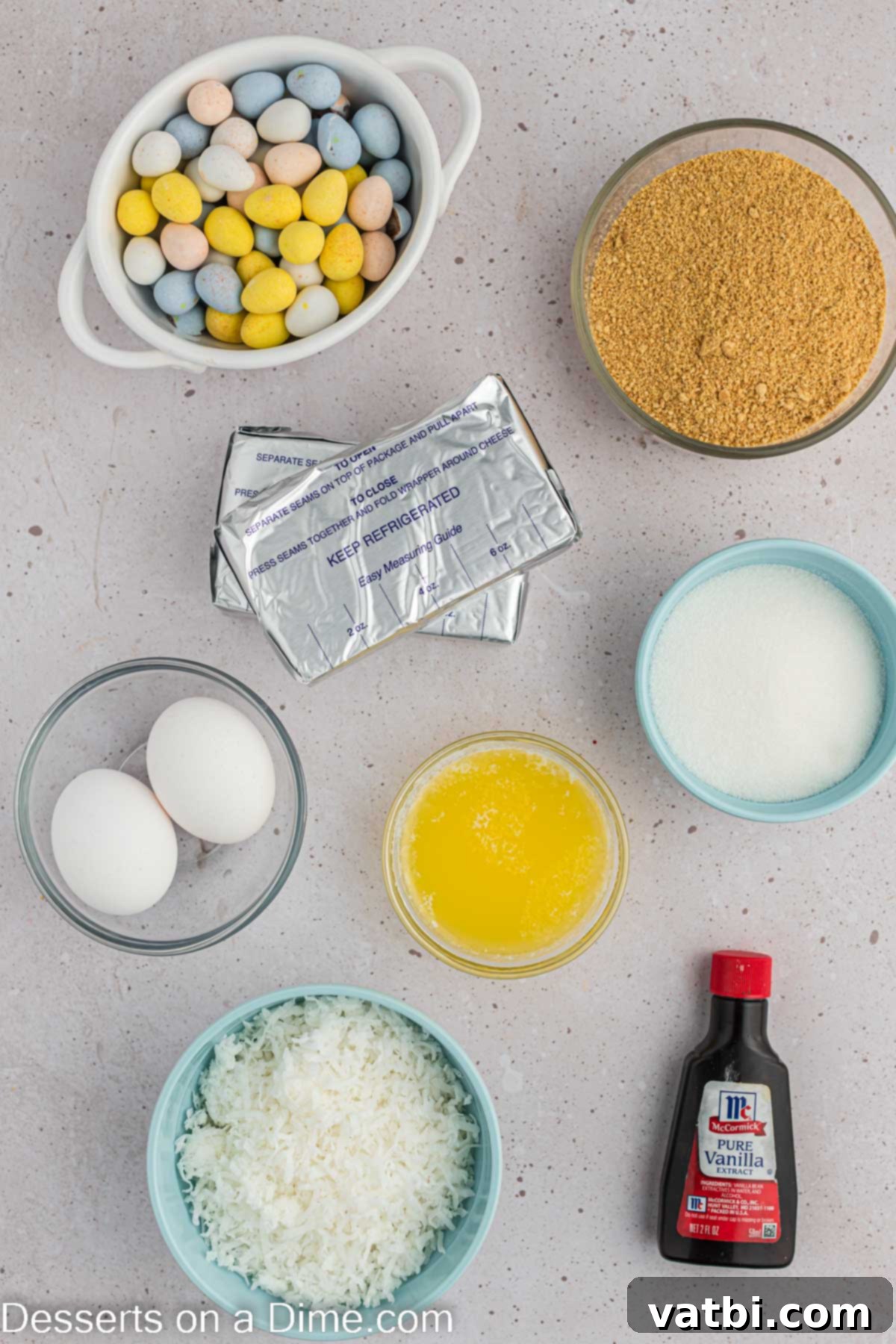 Easter Cheesecake Bites 3 Ingredients needed - graham cracker crumbs, butter, cream cheese, sugar, vanilla, eggs, coconut, robin eggs