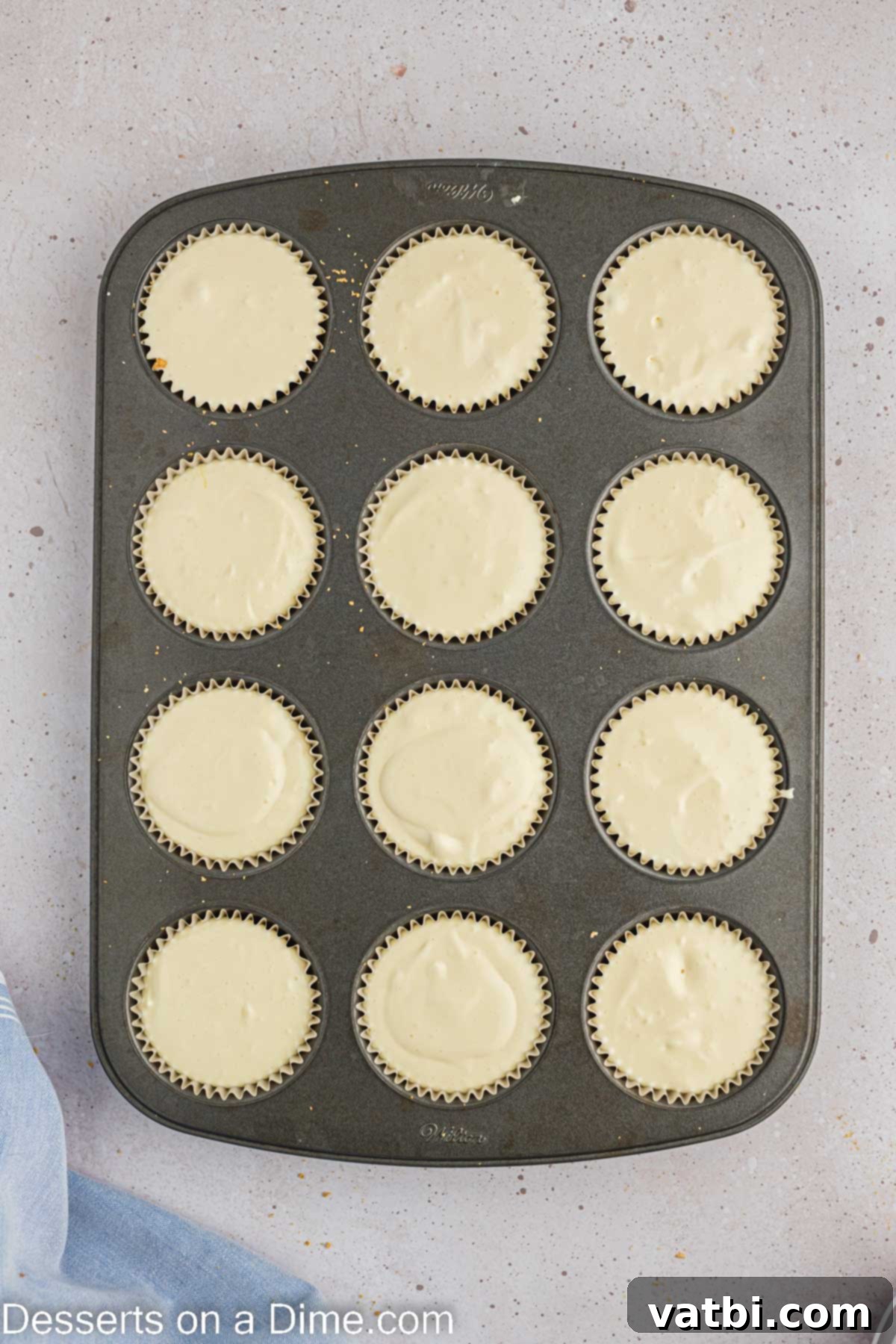 Easter Cheesecake Bites 7 Batter in muffin tin.