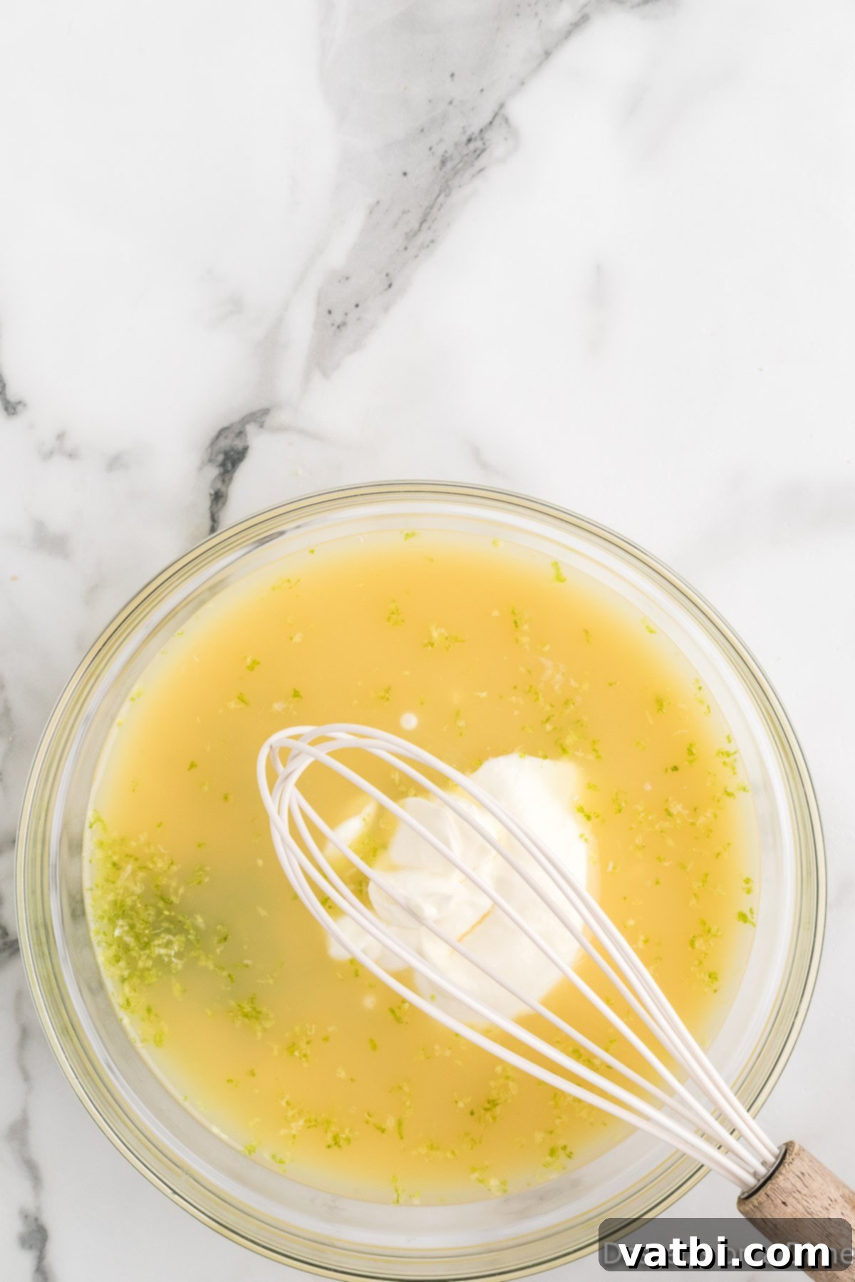 Simple Key Lime Pie Perfection 6 Pie filling ingredients added to a mixing bowl.
