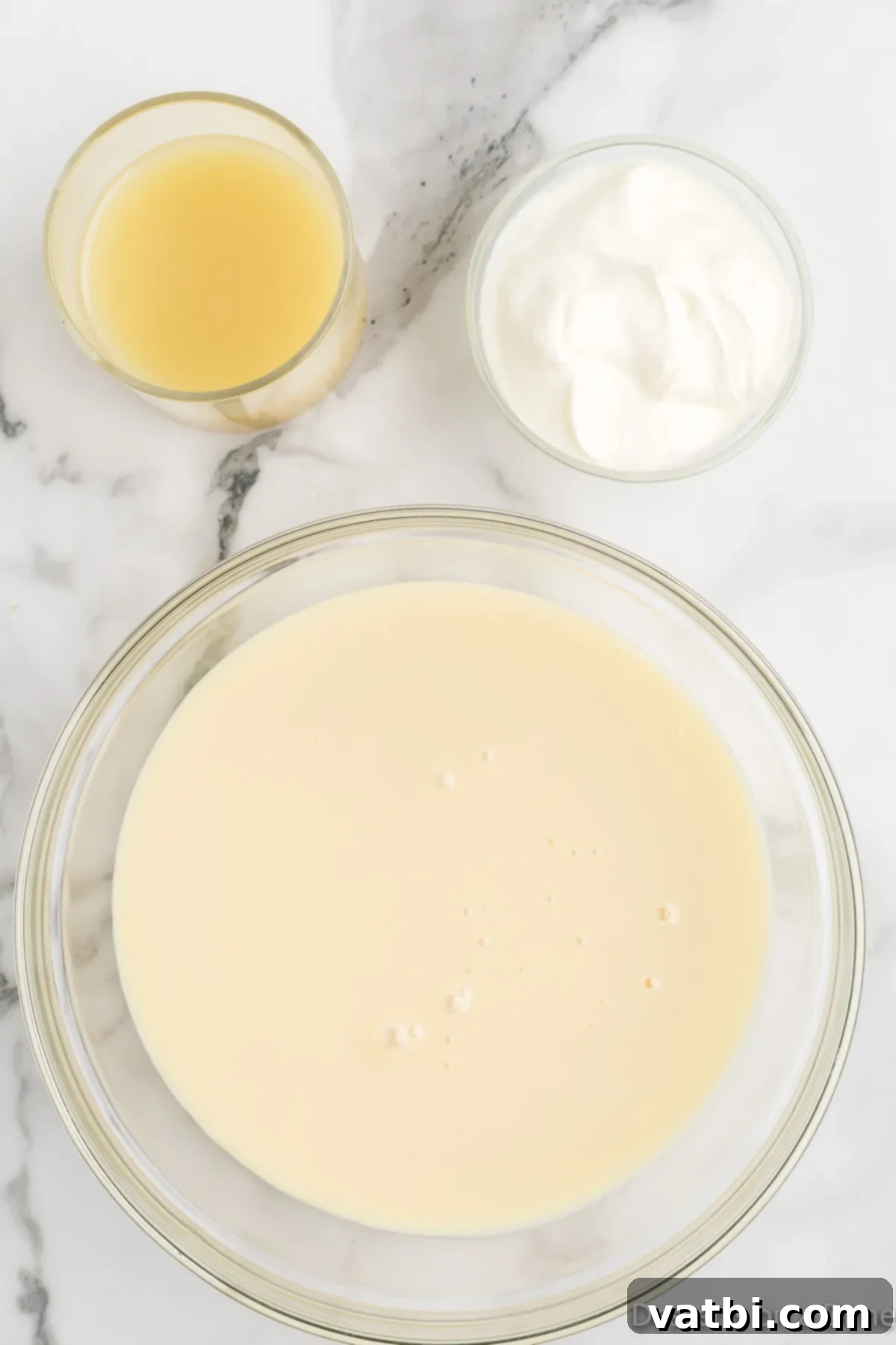 Simple Key Lime Pie Perfection 7 Key lime pie filling combined and smooth in a bowl.