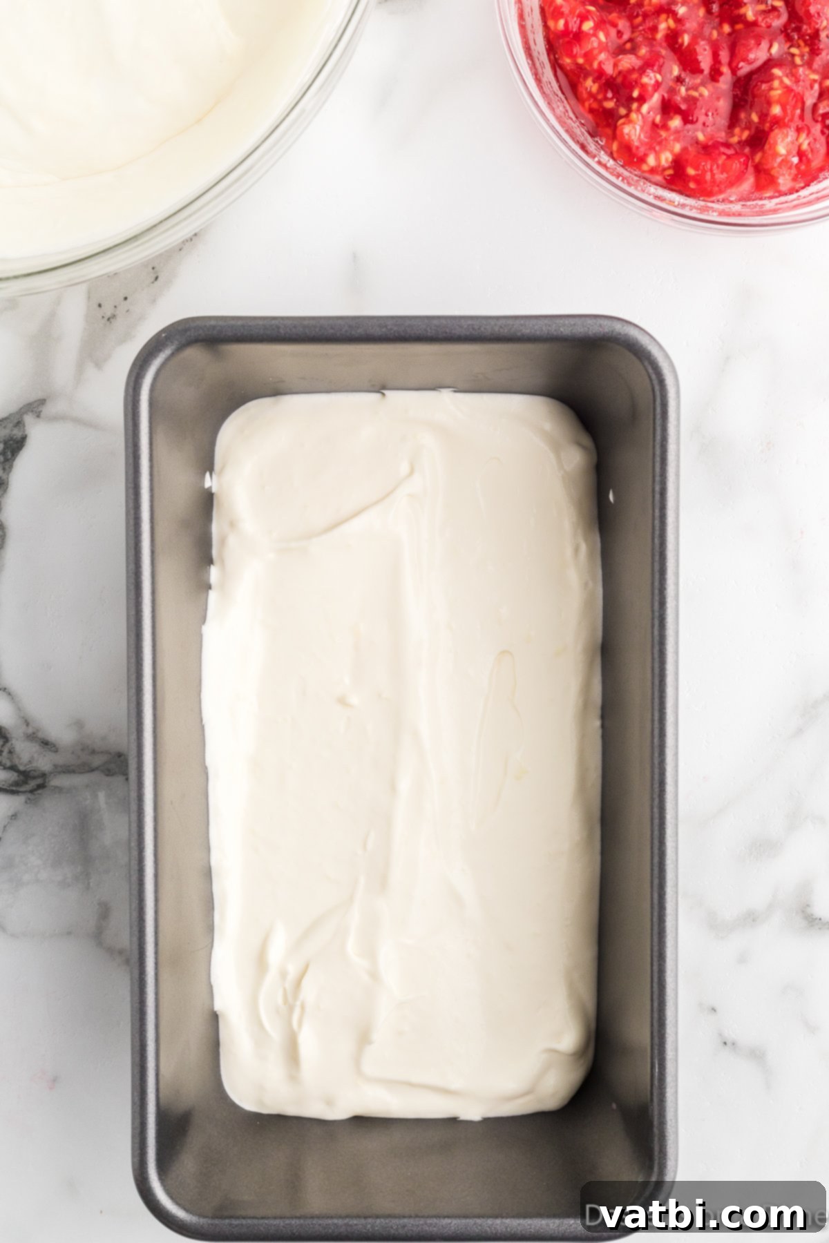White Chocolate Raspberry Dream 8 Half of the ice cream mixture spread into a loaf pan.