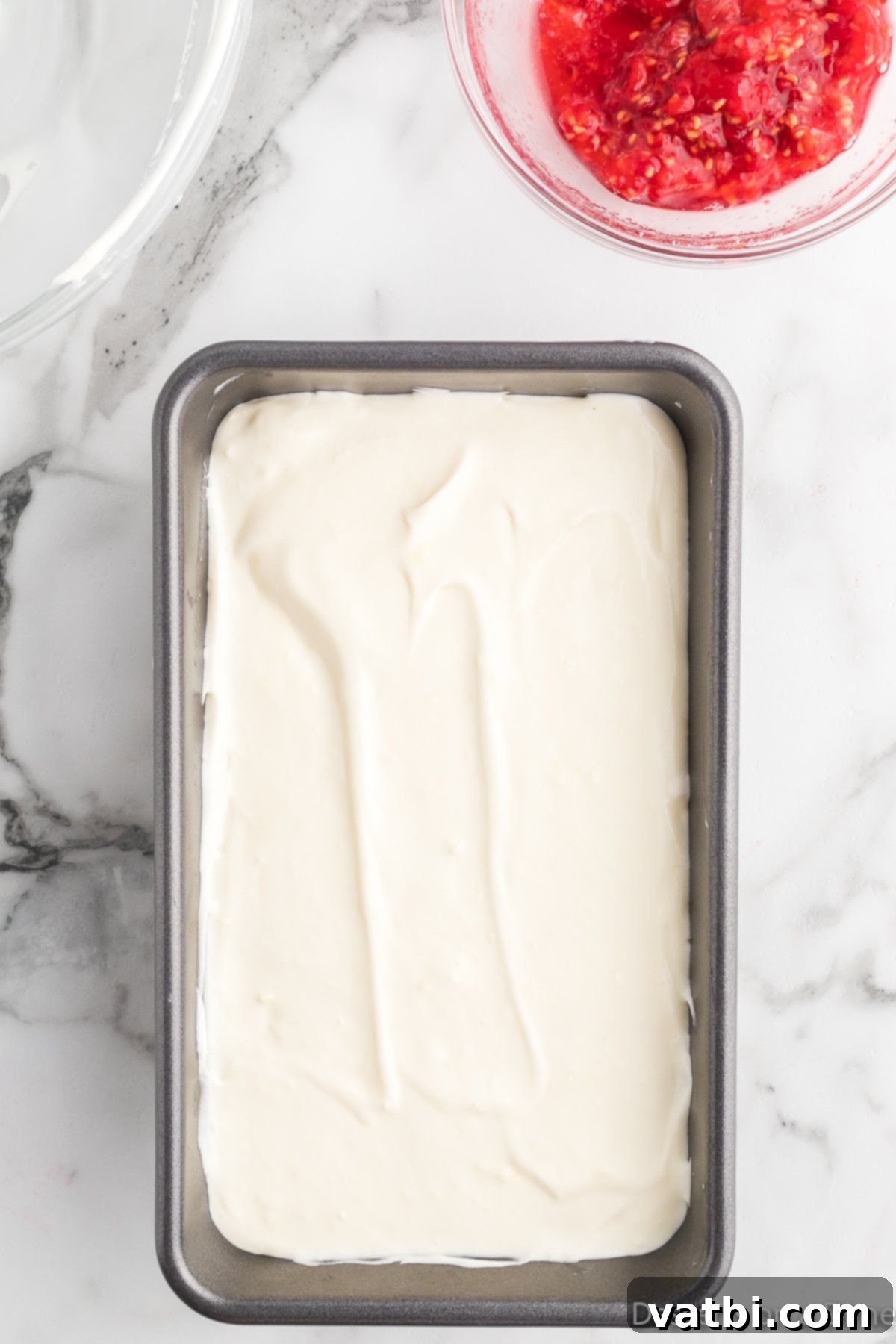 White Chocolate Raspberry Dream 10 Second layer of ice cream base spread over the raspberry swirl.