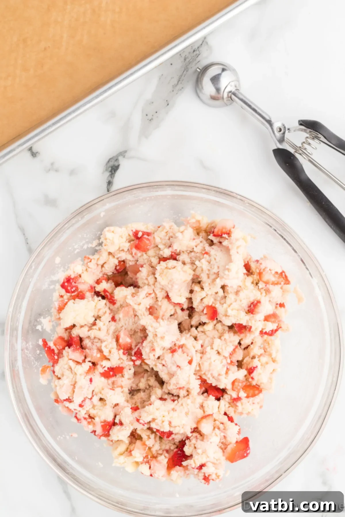 Strawberries folded into dough. 