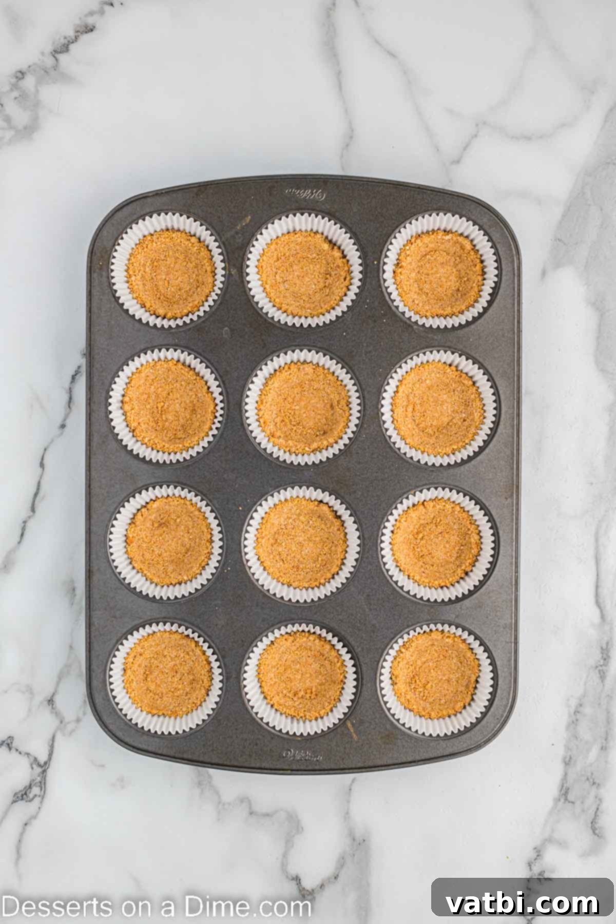 Ultimate S'mores Cupcakes 5 Graham cracker crumbs pressed into pan.