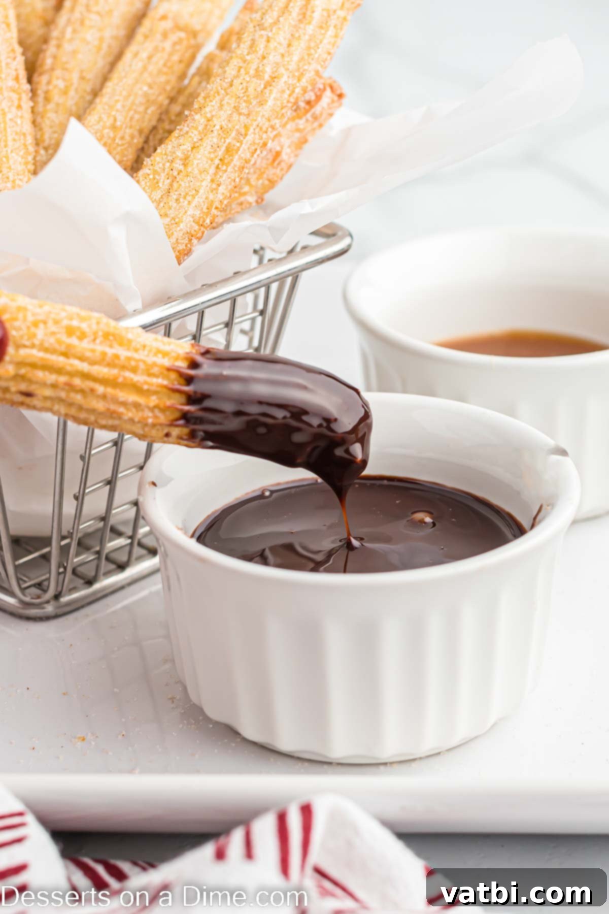 Crispy Air Fryer Churros 12 Crispy Air Fryer Churros dipped in rich chocolate sauce, showcasing their golden texture and delicious pairing.
