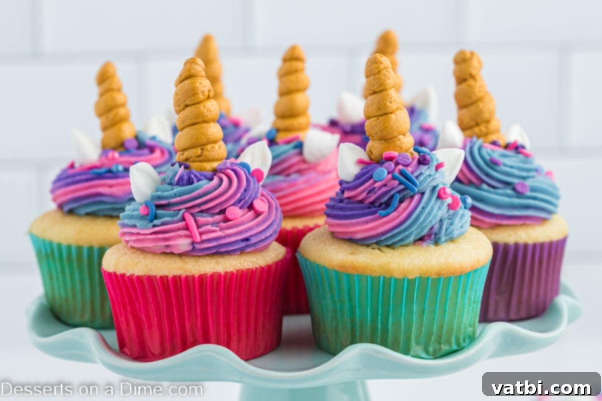 Magical Unicorn Cupcakes 2 Vibrant unicorn cupcakes adorned with pastel frosting, golden horns, and colorful sprinkles, arranged on a elegant platter.