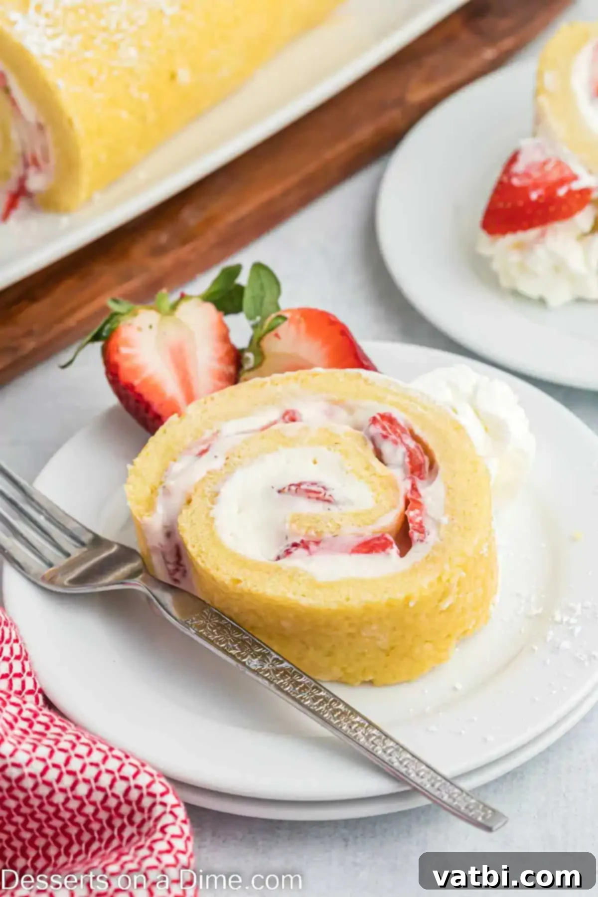 Strawberry Shortcake Swiss Roll 13 Strawberry Shortcake Roll sliced on a plate