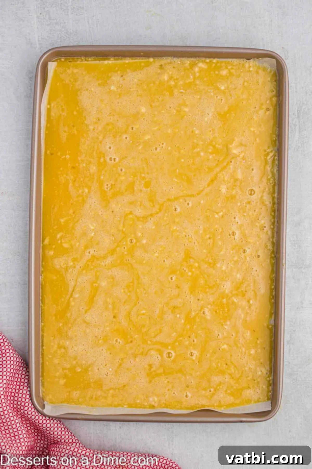 Strawberry Shortcake Swiss Roll 5 Batter spread into pan.