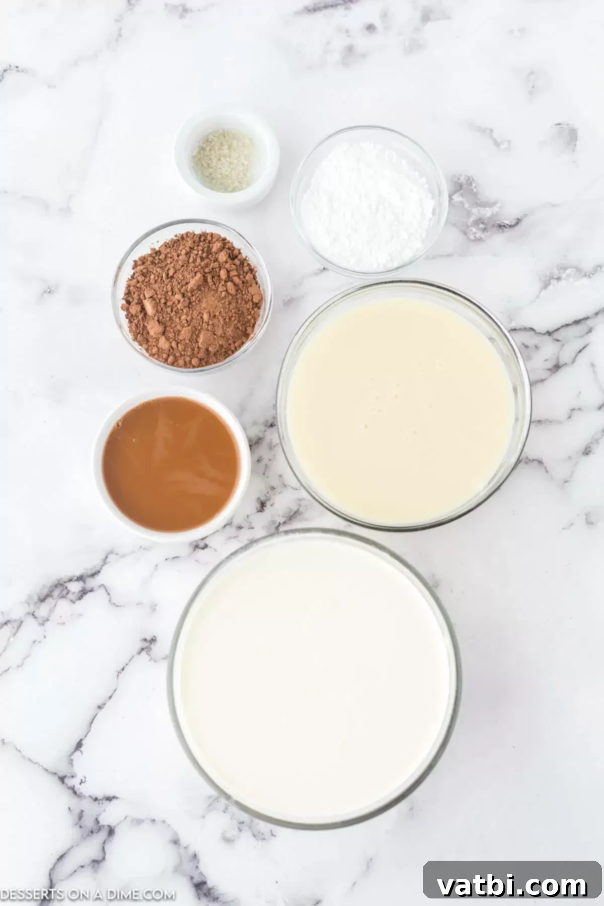 Ingredients needed - heavy whipping cream, powdered sugar, sweetened condensed milk, cocoa powder, caramel sauce, salt