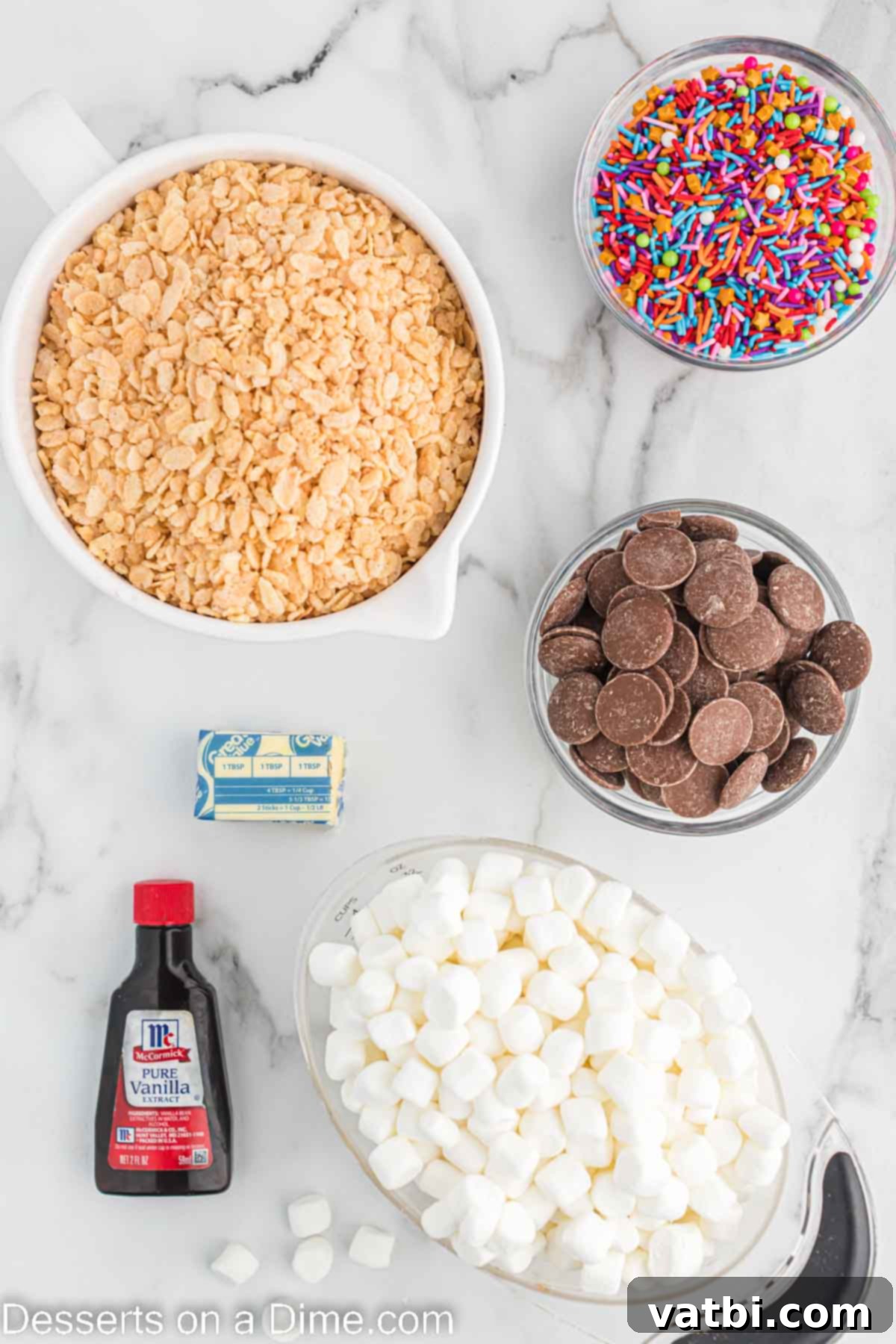 No-Bake Chocolate Crispy Treats 3 Ingredients for Chocolate dipped rice krispie treats - rice krispie cereal, butter, mini marshmallows, vanilla, chocolate melting chips, sprinkles.