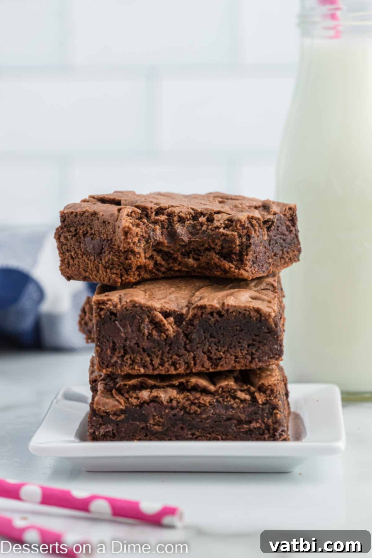 Perfectly cut cake mix brownies arranged on a cooling rack, showcasing their fudgy texture.