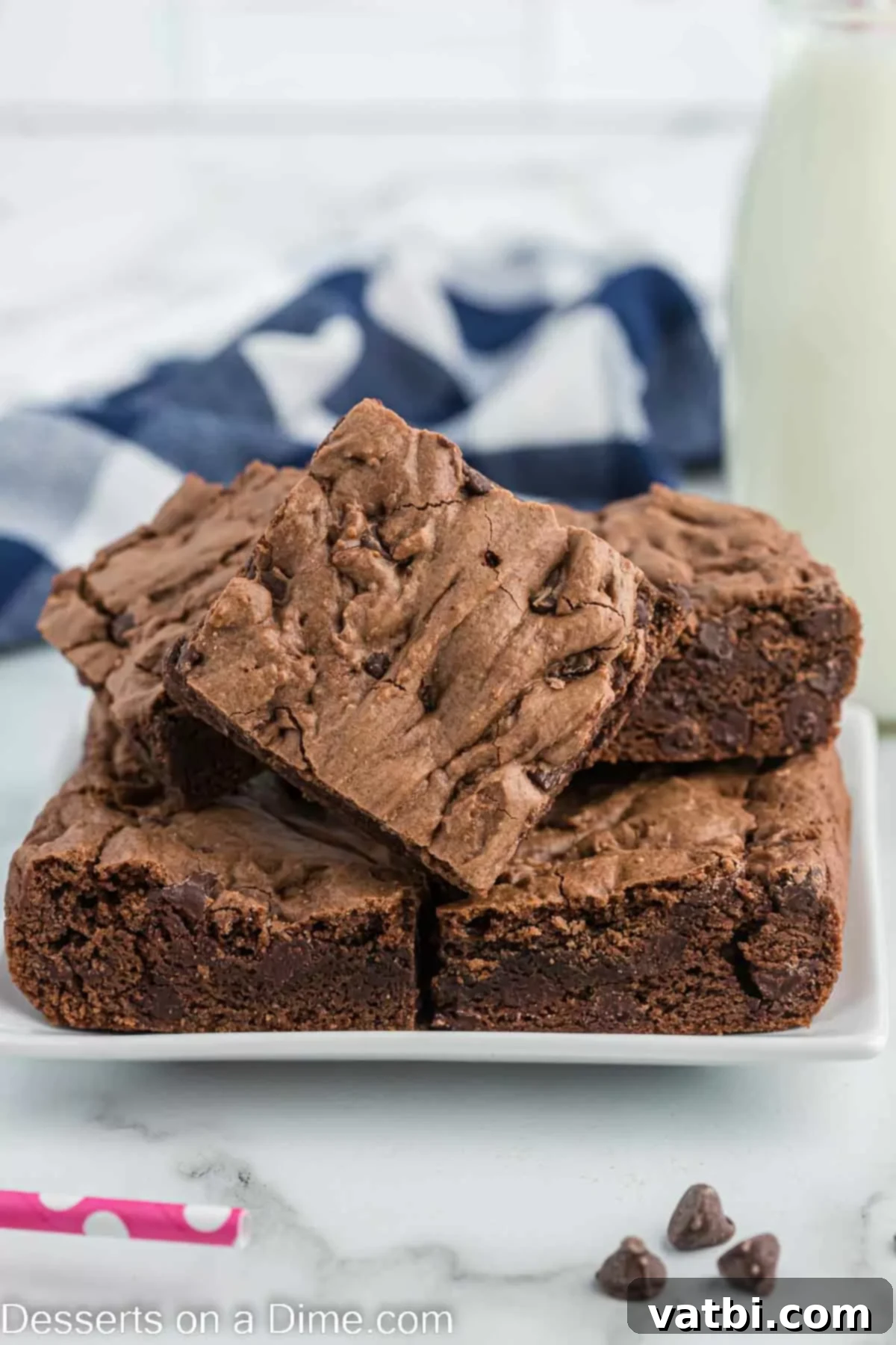 Freshly baked cake mix brownies, cut into neat squares and arranged on a cooling rack.