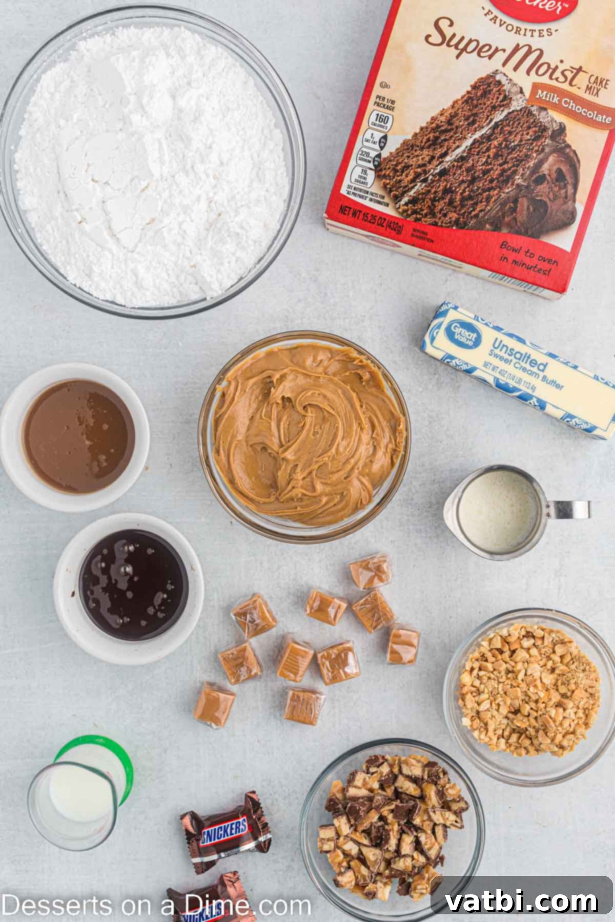 Ultimate Snickers Cupcakes 3 Ingredients for cupcakes - cake mix, caramel candy, heavy cream, salted peanuts, butter, peanut butter, powdered sugar, caramel sauce, chocoalte sauce, snicker bars.