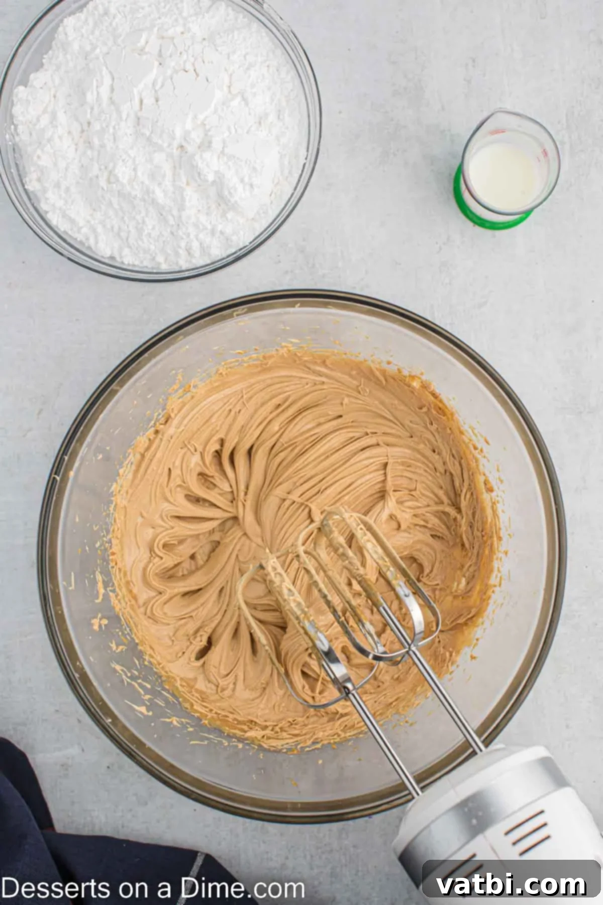 Ultimate Snickers Cupcakes 8 Frosting mixture creamed together in bowl.