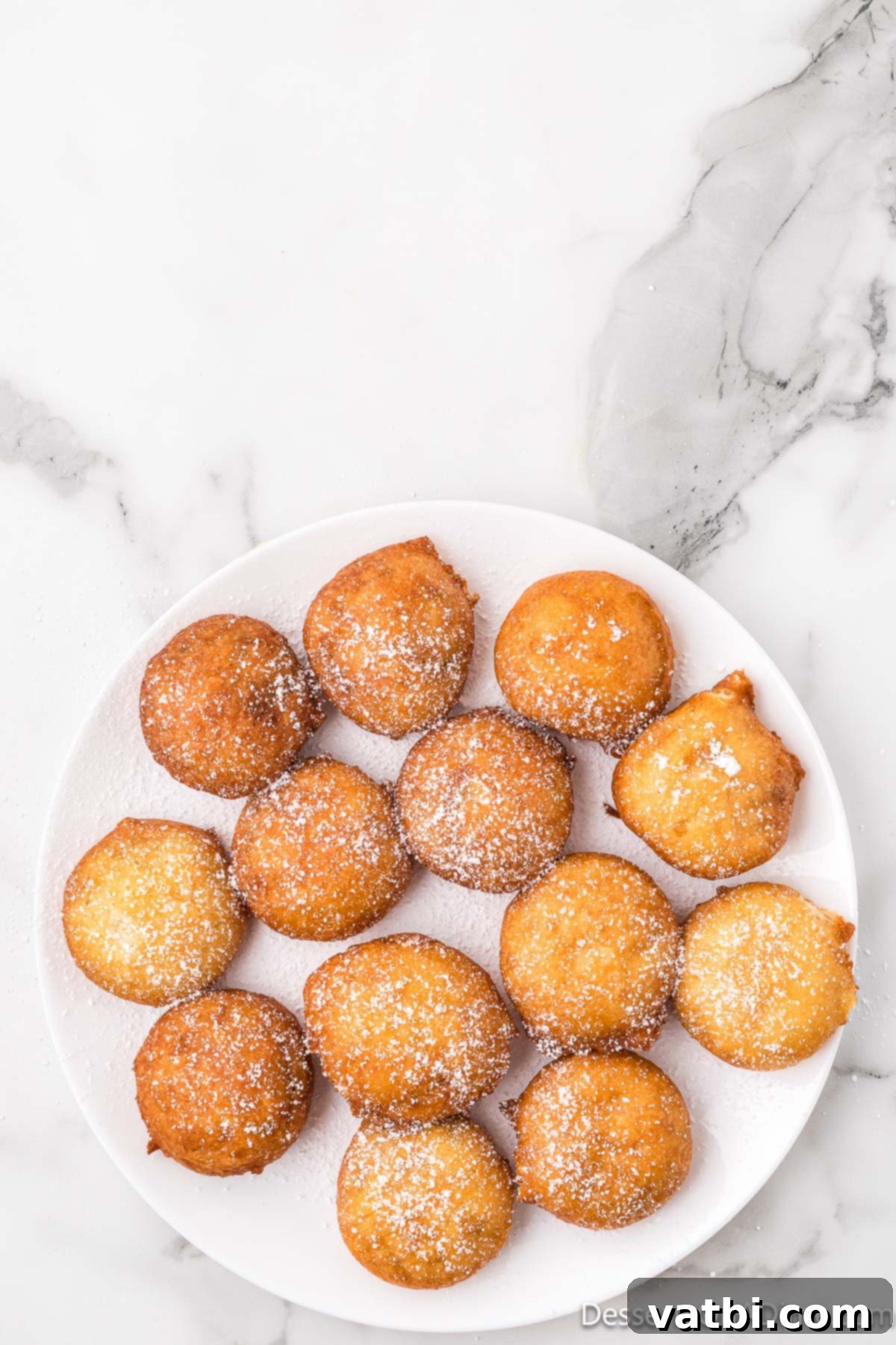 Fried Oreos 7 Powdered sugar sprinkled on fried Oreo cookies.