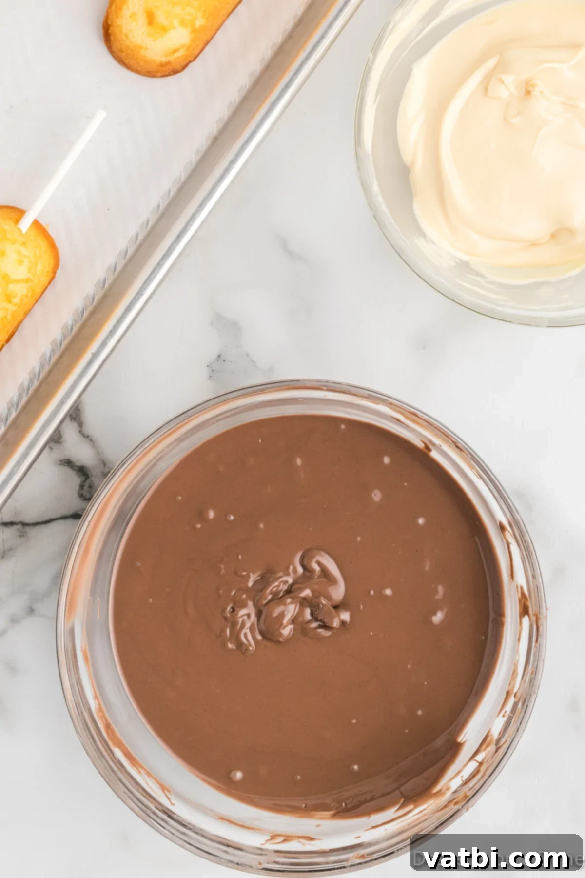 Irresistible Chocolate Glazed Twinkies 5 Melted chocolate in a bowl.