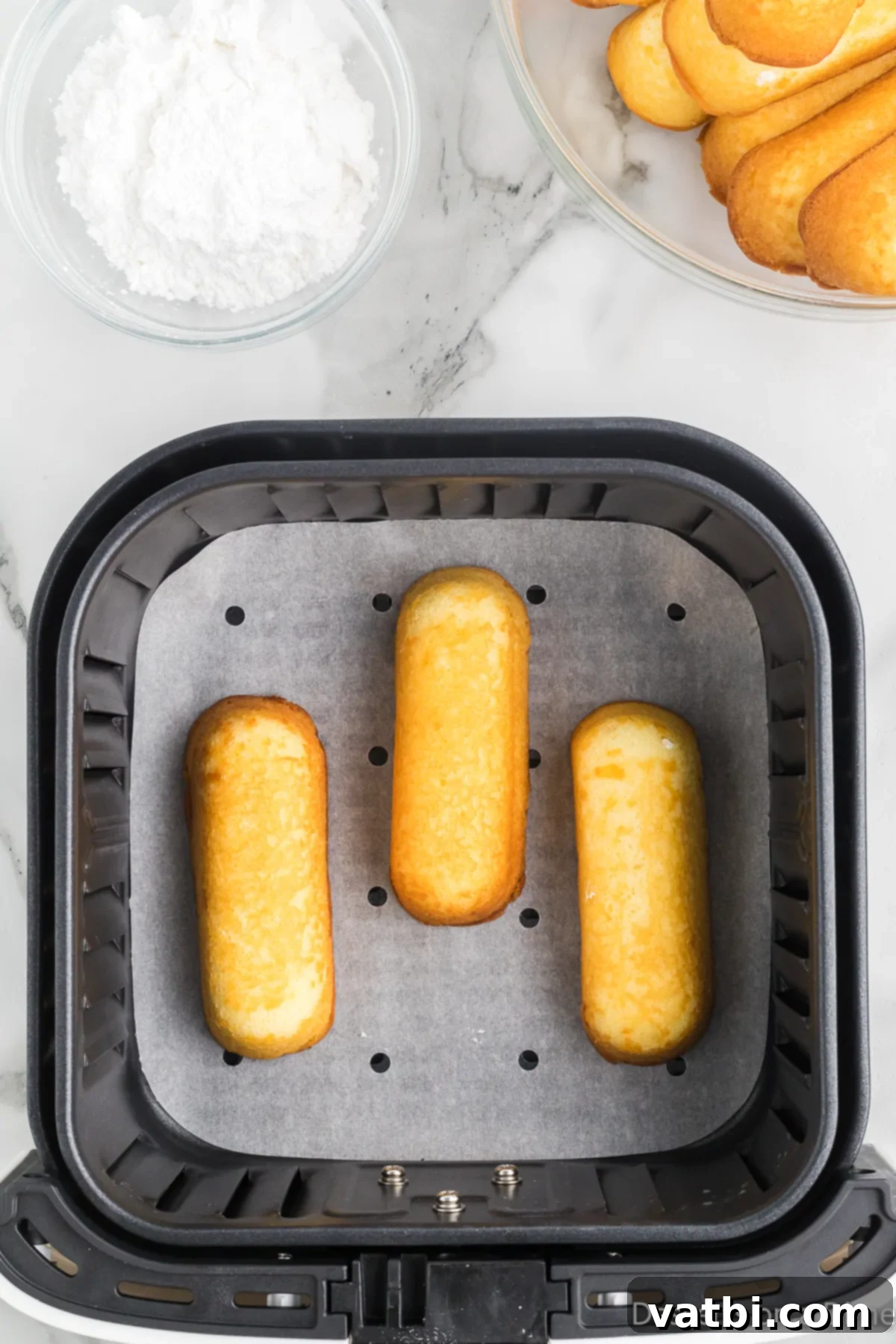 Golden Air Fried Twinkies 4 Twinkies in air fryer.